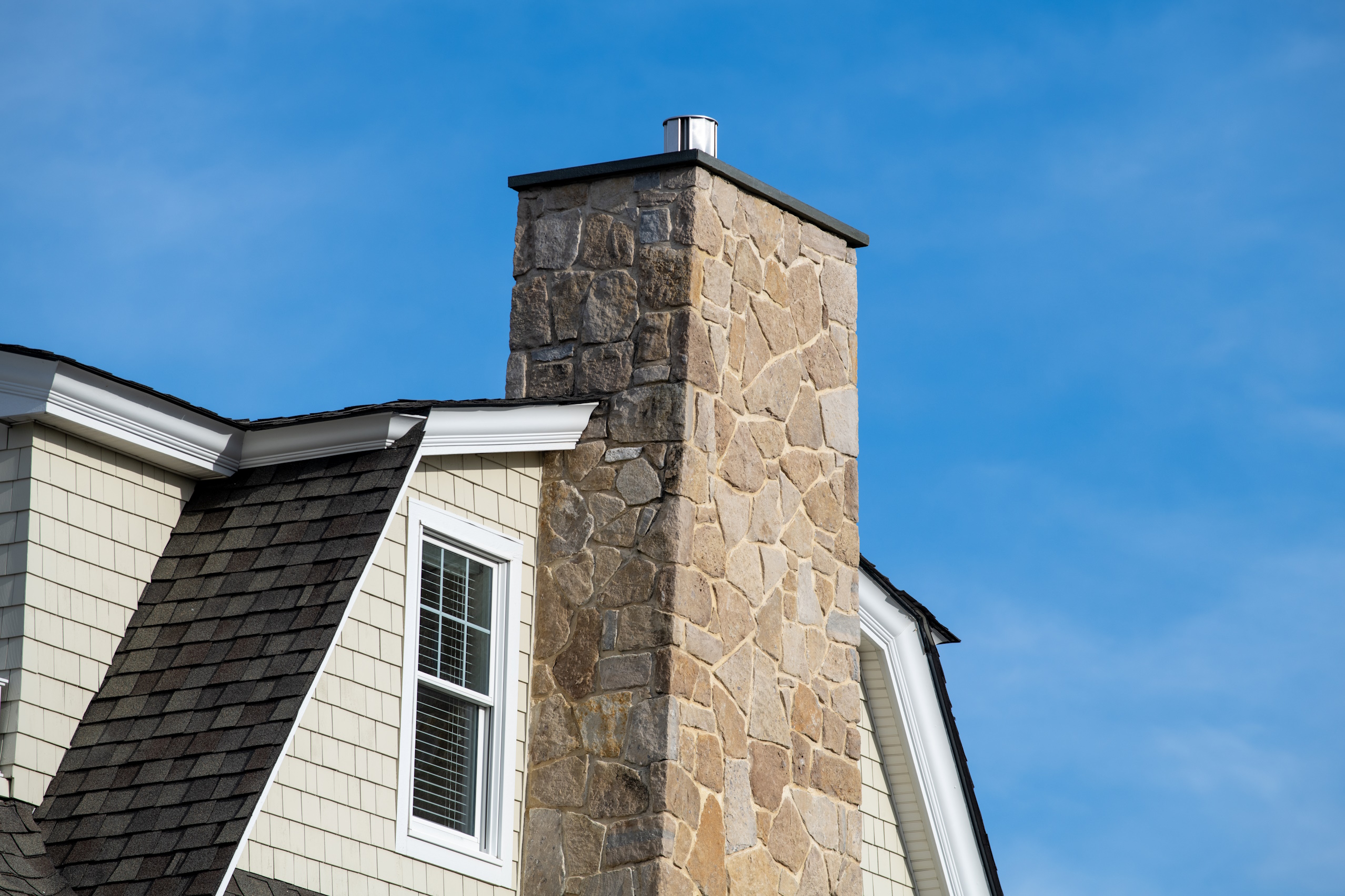 stone chimney side of house